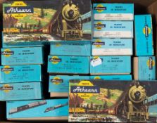 A collection of Athern (USA) rolling stock:, including a Santa Fe 50-ft flat plate with two vans,