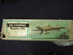 Three scale model flying aircraft kits:, an Olympic Super-Fli,
