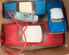 A battery operated tinplate Oldsmobile:,