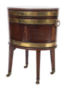 A George III mahogany, inlaid and brass bound oval wine cooler on stand,
