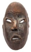 A Lega tribe (Zaire) 20th century carved wooden mask: 29cm high.