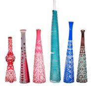Six various glass cheroot or cigarette holders: comprising four colour flashed examples with cut