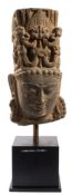 A large Indian sandstone Vishnu head fragment: sculpted in high relief and adorned with an