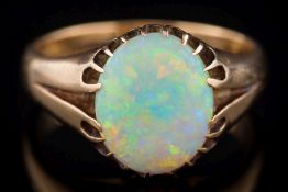 A gentleman's 18ct gold and opal single-stone ring: the oval opal approximately 12.7mm long x 10.