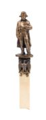 A cast metal terminal in the form of Napoleon : in military uniform,