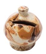 A 19th century slipware pottery money box: of globular form decorated with marbled brown and ochre