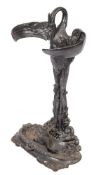 A cast iron umbrella stand,: in the form of a heron about to devour a fish from a pool,