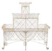 A wirework and white painted plant stand of D shaped outline:,