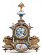 A French gilt-metal and porcelain mantel clock: the eight-day duration movement striking the hours