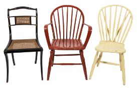 An early 19th century painted hoop back Windsor arm chair attributed to Yealmpton,