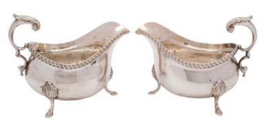 A pair of Elizabeth II silver sauceboats, maker's mark worn possibly LF & Co Ltd, London,