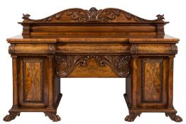 An early Victorian mahogany sideboard,: of recessed breakfront outline,
