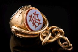 A 19th century gold triple opening swivel fob seal: with three crested or monogrammed intaglios and
