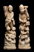 A pair of Japanese carved ivory okimono figures: each man in peasant costume with their son,