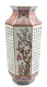 A Chinese porcelain vase: of shouldered hexagonal profile enamelled front and verso with lotus and