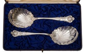 A pair of sterling silver serving spoons, bear import marks for London, 1899: crested,