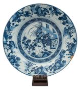 A large Dutch [De Pauw] blue and white delft charger: painted in Chinese Transitional style with