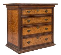 A walnut banded and seaweed marquetry rectangular chest:, of small size with an overhanging top,