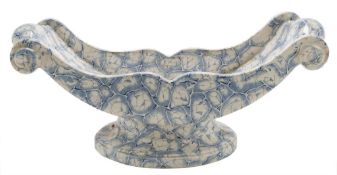 A Staffordshire pottery cheese coaster: of footed sledge-shaped form,