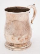 A George II silver tankard, maker's mark worn possibly IG, London, 1733: of plain baluster form,