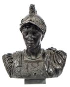 A bronze bust of a Roman soldier : wearing a lion crested helmet with laurel wreath decoration,