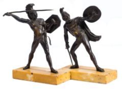 A pair of Grand Tour bronze figures of Greek warriors: one throwing a spear,