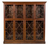 An oak bookcase:, with a moulded dentil cornice,