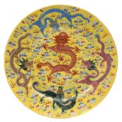 A Chinese porcelain 'dragon' plate: enamelled with a central dragon guarding a pearl and surrounded
