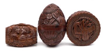 A 19th century treen egg-shaped box: with screw top decorated in low relief with flowerheads and