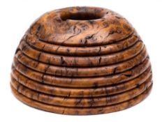 A brown oak burr pen stand: of beehive form, inscribed and signed Char, 14 cm wide.