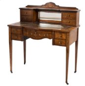 A lady's Edwardian rosewood and marquetry writing desk:, of bowed breakfront outline,