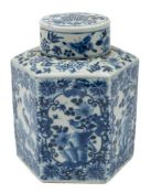 A Chinese blue and white sauceboat and a tea caddy and cover: the sauceboat of silver shape,