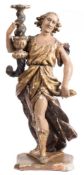 A 17th Century Continental carved giltwood and polychrome decorated figure: of a woman dressed in