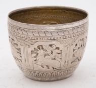 An Indo-Persian silver tumbler: with embossed animal and bird decorated panels, 6.5cm. high, 8.25cm.