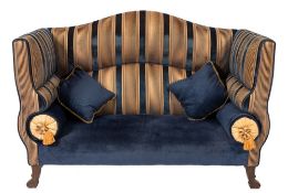 A contemporary sofa by Dudgoen of London:, upholstered in Royal blue and gold striped jab fabric,