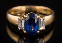 A sapphire and diamond three-stone ring: the oval sapphire 9.