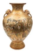 A large pair of Satsuma earthenware vases: of baluster form with grotesque mask handles,
