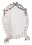 An Edward VII silver easel mirror, maker Elkington & Co, London, 1906: initialled, of oval outline,