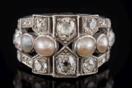 An art-deco 'pearl' and diamond cluster ring: of pierced design with cushion shaped,