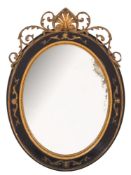 An ebonised and gilt gesso oval mirror:, with palmette and pierced acanthus scroll cresting,