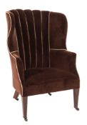 An Edwardian mahogany curved wing frame armchair:, fully upholstered in brown dralon velvet,