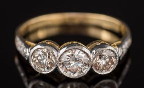A graduated diamond three-stone ring: with round,