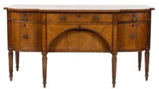 A Regency mahogany and inlaid sideboard,: of bowed and breakfront outline,