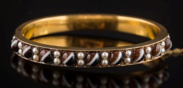 A 19th century banded agate bead and seed pearl hinged bangle: with nine banded agate beads each