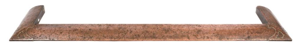 A copper fire kerb in the Arts and Crafts manner,