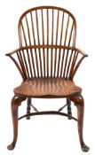 An 18th Century yew-wood and elm stick back Windsor elbow chair:,