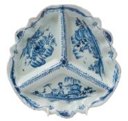 An English blue and white delftware three-division tripod sweetmeat dish: painted with Chinese