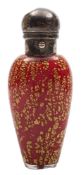 A white and red cased glass scent bottle: the slender oviform body with gold foil inclusions with e.