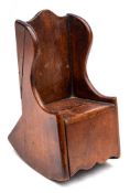 A 19th Century treen money box: in the form of a child's miniature rocking chair: 16 cm high.