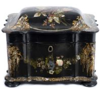 A Victorian papier mache and mother-of-pearl inlaid tea caddy: of serpentine outline,